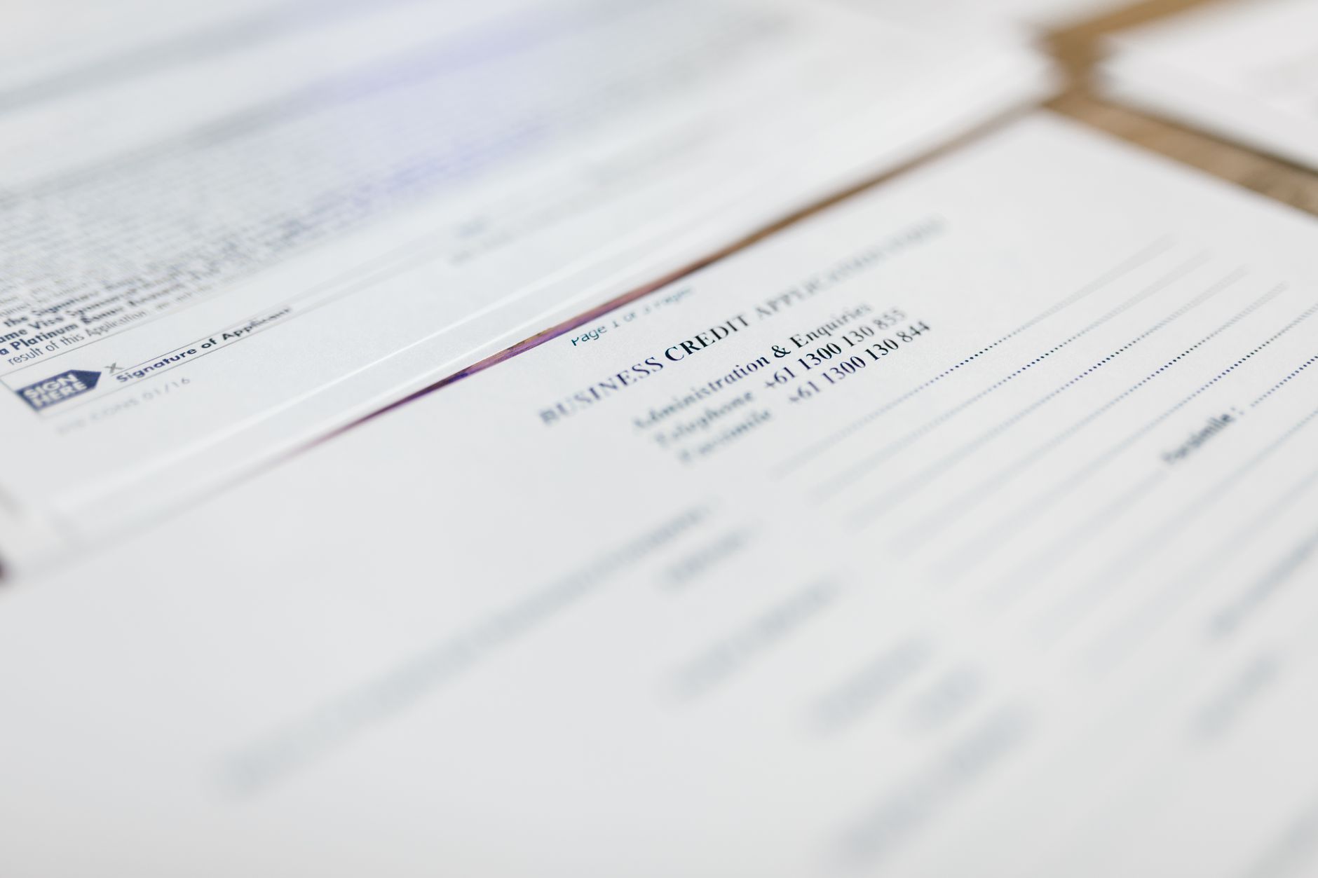 Focused image of business credit application papers, ideal for finance themes.